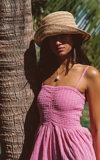 New swimwear, clothing, accessories, and basics are shown across four images. Colors featured include pink, white, and tan.